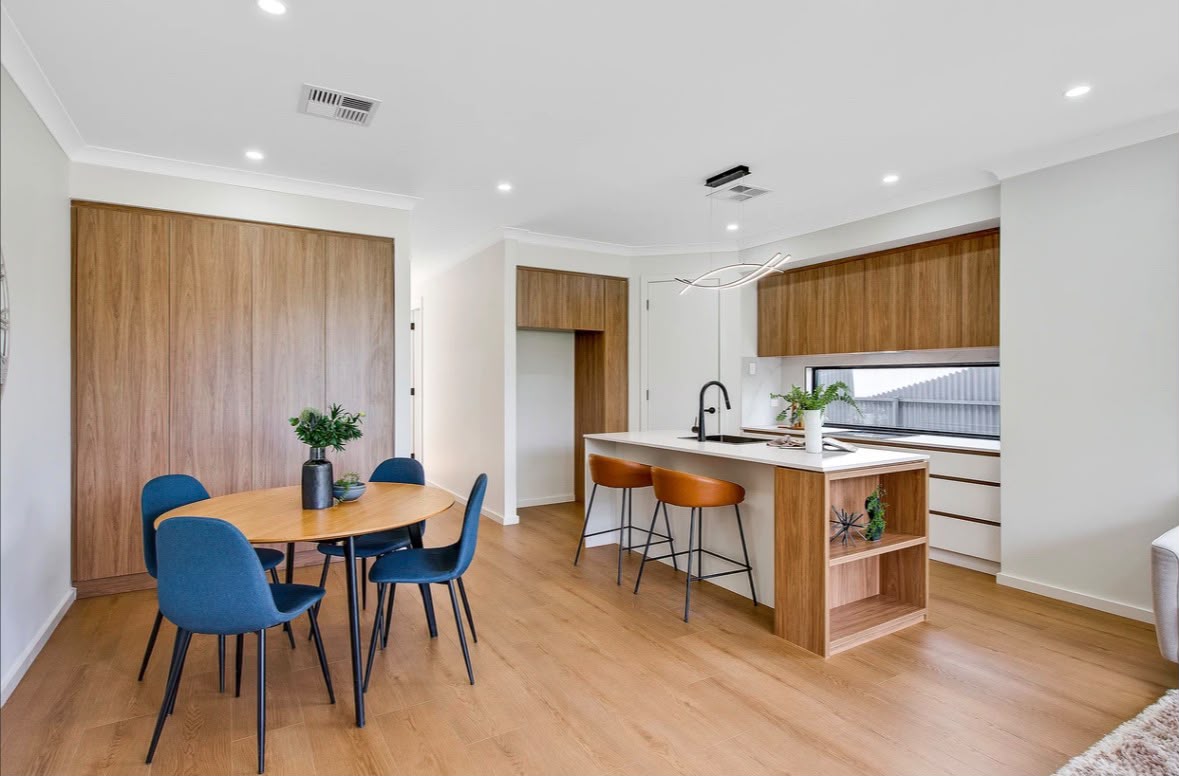 Open-plan kitchen with timber-look cabinetry and island bench