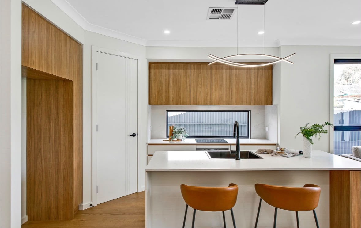 Timber overhead cabinets and tall pantry joinery